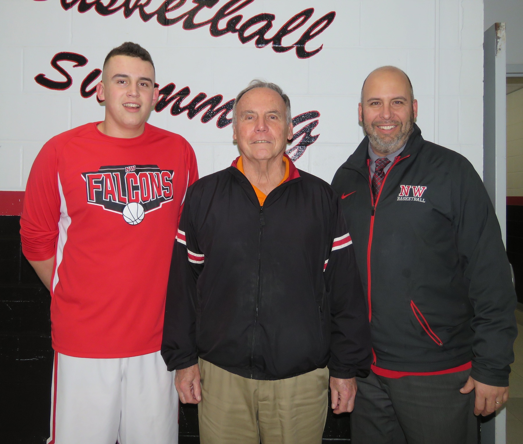 `We're the Miller:` From left, Cam, Don and Steve Miller pose for a photo before the Niagara-Wheatfield boys basketball team's contest versus Niagara Falls. (Photo by David Yarger)